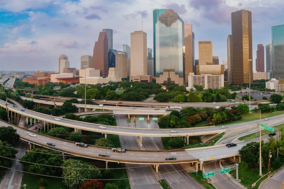 View of downtown Houston with elevated freeways in foreground.